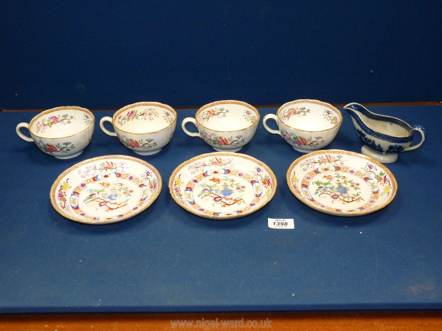 Miscellaneous 19th c. breakfast cups and saucers and a blue and white sauce boat.