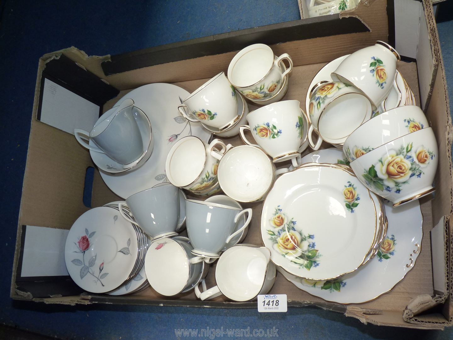 A Duchess yellow rose part Teaset including twelve cups, saucers and plates, two bowls,