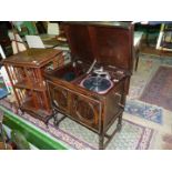 A music cabinet having an Edison Bell gramophone with winder, 27 1/2'' x 18'' x 32'' tall.