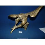 A large brass eagle, 20" wide (wing to wing) x 14" tall (at highest point).