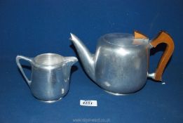 A Piquot ware Teapot and jug.