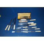 Fourteen pieces of bone handled cutlery including a boxed set of knives, fish knives,