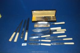 Fourteen pieces of bone handled cutlery including a boxed set of knives, fish knives,