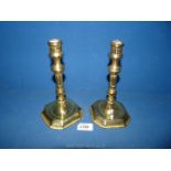 A pair of brass candlesticks.