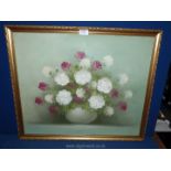 A framed Oil on canvas depicting a vase of flowers, signed lower right R. Cox, 26" x 22".