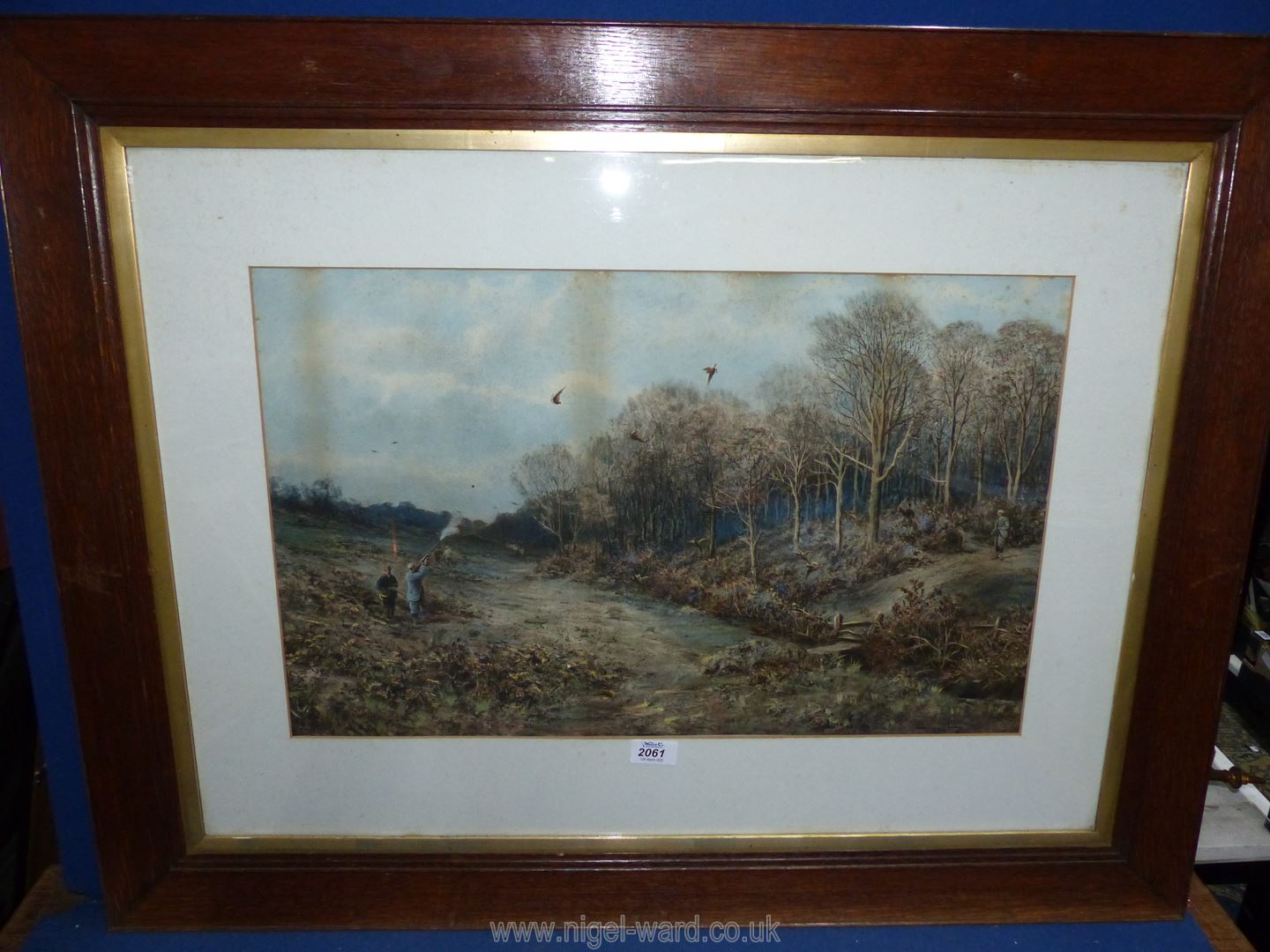 A large wooden framed Print signed lower left Douglas Adams, dated 1893 depicting a pheasant shoot.