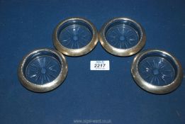 Four sterling silver rimmed glass Coasters, makers Frank M. Whiting & Co.