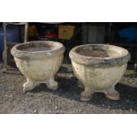 A large pair of concrete Planters having grape design and standing on four splayed feet,