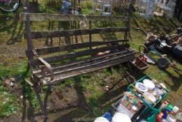 A wrought iron framed garden bench, 69" long x 3' high x 26" wide.