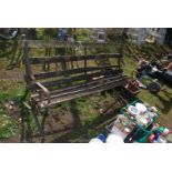 A wrought iron framed garden bench, 69" long x 3' high x 26" wide.