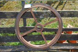 A Cambridge roll cast iron wheel, 20" diameter.