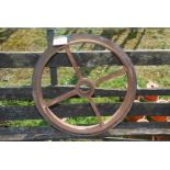 A Cambridge roll cast iron wheel, 20" diameter.