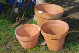 Three terracotta pots.