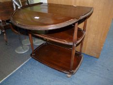 An Ercol trolley/table on castors with drop leaves, extending to 27 1/2" x 29" wide x 30" high.