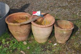 Three graduated terracotta garden planters - approx. 9" diameter x 7 1/2"-10" tall.