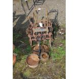 An old metal dog crate, shoe bracket, glue pot and skillet.