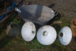 A galvanised bath 2' x 19" wide and four enamel light shades.