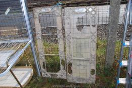 Two cast iron window frames - some glass missing, 42" x 16".
