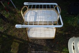 A two tier trolley and a clothes airer.