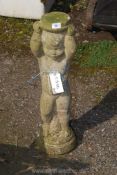 A concrete stand of a putto, 26 1/2" tall.