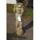 A concrete stand of a putto, 26 1/2" tall.