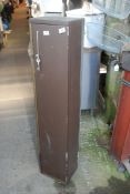 A small gun cabinet with key, 4' high x 10" wide x 8" deep.