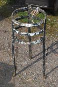 A metal pot stand, 10 1/2" wide x 26" tall.