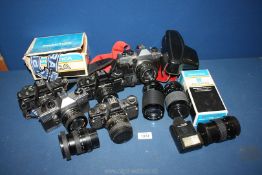 A Collection of 5 Praktica 35mm SLR Cameras and Lenses etc,