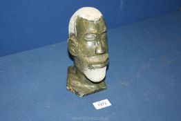 A Soapstone carved male head.