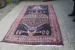 A Persian Nahavand, thick pile Village rug, deep ground, Medallion design, 2.9m x 1.5m.