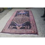 A Persian Nahavand, thick pile Village rug, deep ground, Medallion design, 2.9m x 1.5m.