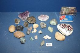 A quantity of rocks and stones including amethyst, fossils, painted rock, broken pipe head,