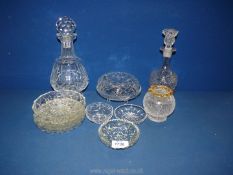 Two decanters, a small crackle glaze night light shade and a quantity of pressed glass dishes.