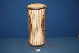 A Bucara Talking Drum from Africa, 16" tall.