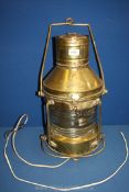 A brass anchor navigation lamp converted to electric, 18'' high x 10'' diameter.