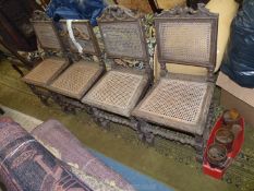 A set of four Oak framed Dining Chairs standing on turned legs with turned and twist detail