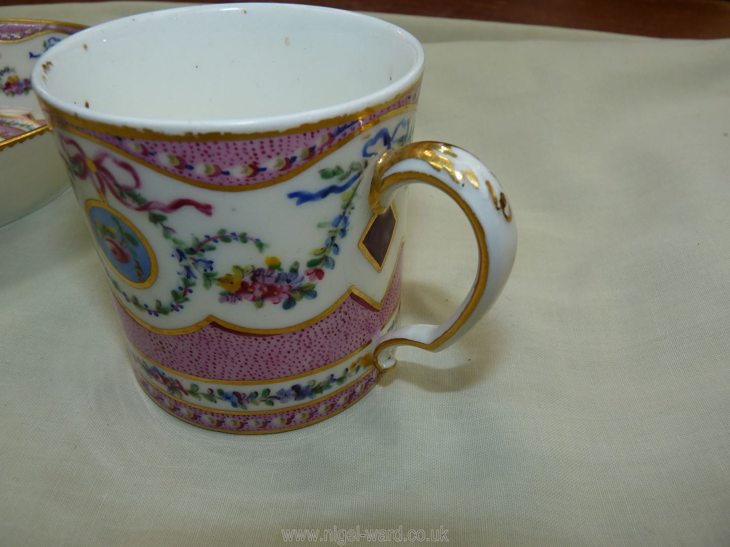 A Sevres coffee can and saucer, painted with floral garlands against a mottled salmon pink ground, - Image 11 of 13