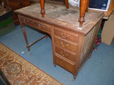 A circa 1900 Oak single pedestal Desk and pedestal with four short drawers,
