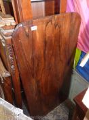 A Rosewood table Top having curved corners, 48'' x 23 3/4''.