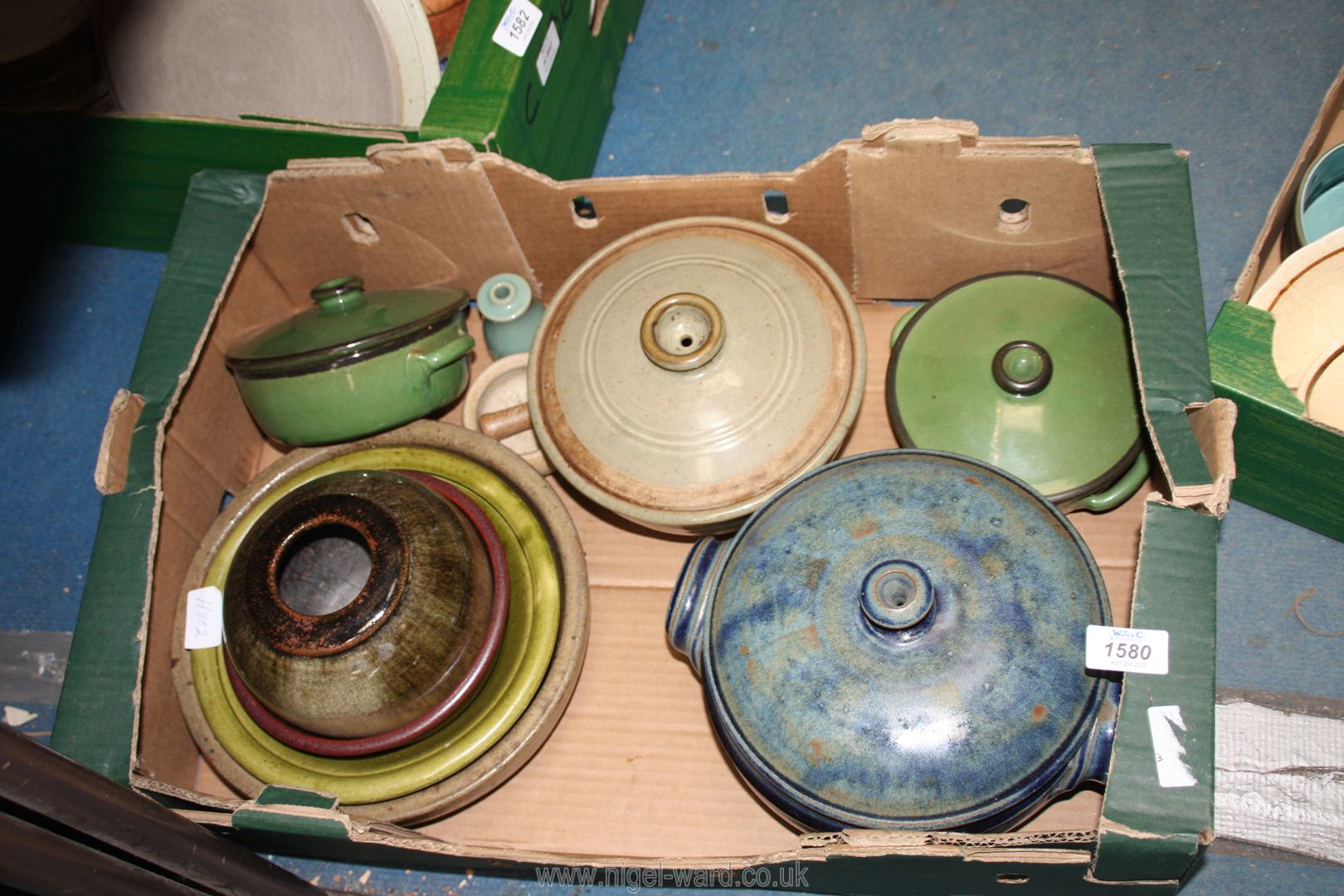A quantity of mixed Studio Pottery to include blue lidded casserole dish, two green lidded pots,