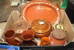 A quantity of slip ware and earthenware lidded pots,