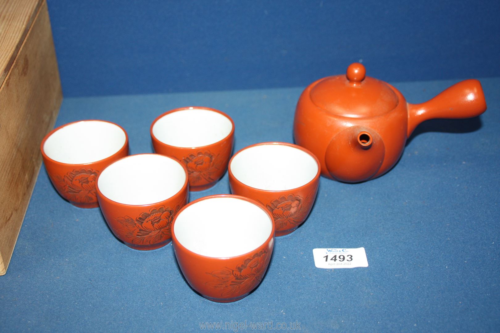 A Chinese Teaset in rust with white interior, held in a wooden case. - Image 2 of 2