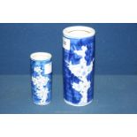 A graduated pair of Chinese tubular spill vases painted in prunus pattern, largest 6" tall.