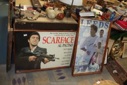 Two framed Posters - Leeds United players, 35'' x 23'' and Scarface Al Pacino, 24 1/2'' x 34 1/2''.