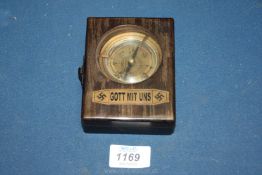 A cased military type Compass having bevelled glass, the loop stamped 1942,