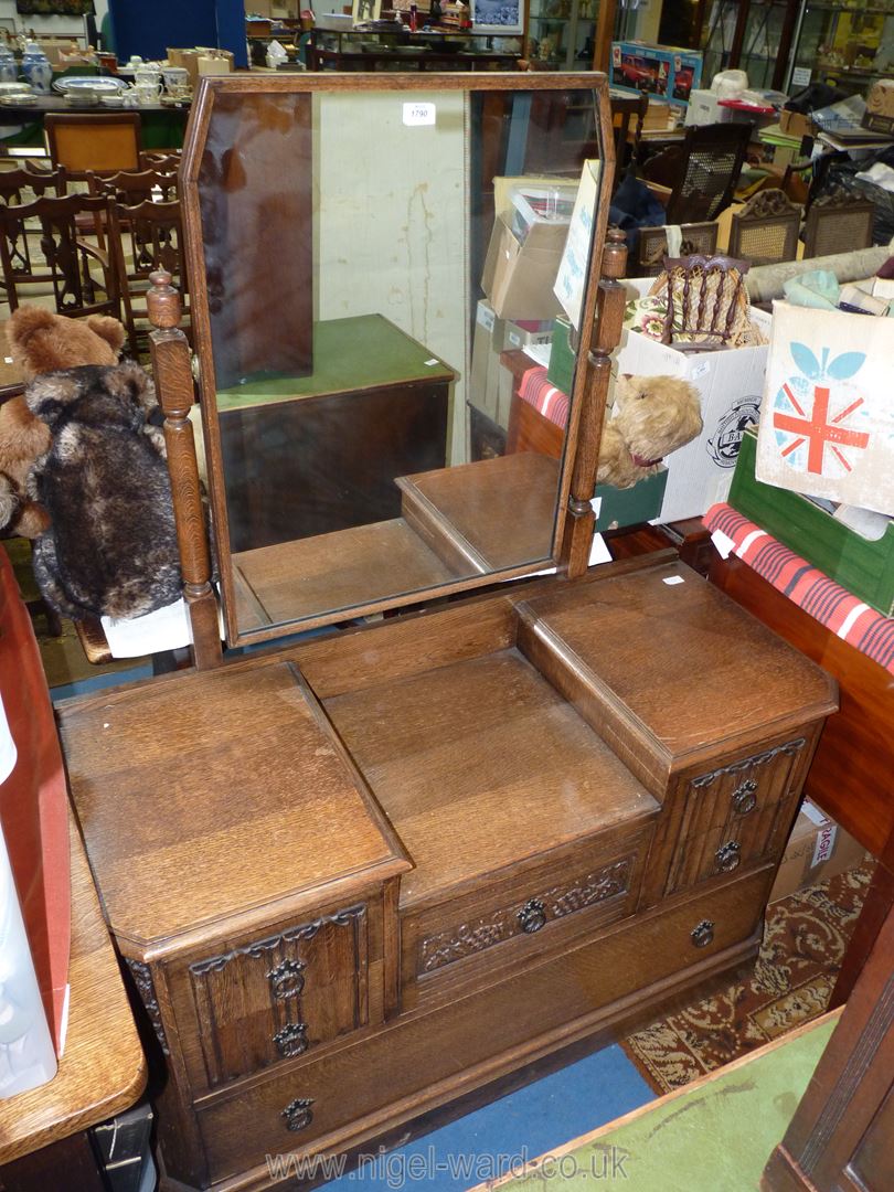 An Oak dressing Table having linen fold and fruiting vine detail and shaped swing mirror, - Image 2 of 2