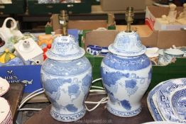 A pair of large blue and white baluster shaped oriental table Lamps with grape and vine decoration,