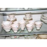 A good quantity of old Foley China tea ware with decoration of pink and green swags and Greek key