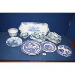 A quantity of blue and white china including Wedgwood serving platter, lidded dishes and stands,