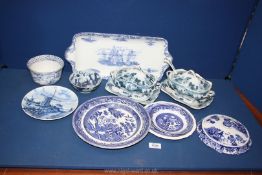 A quantity of blue and white china including Wedgwood serving platter, lidded dishes and stands,